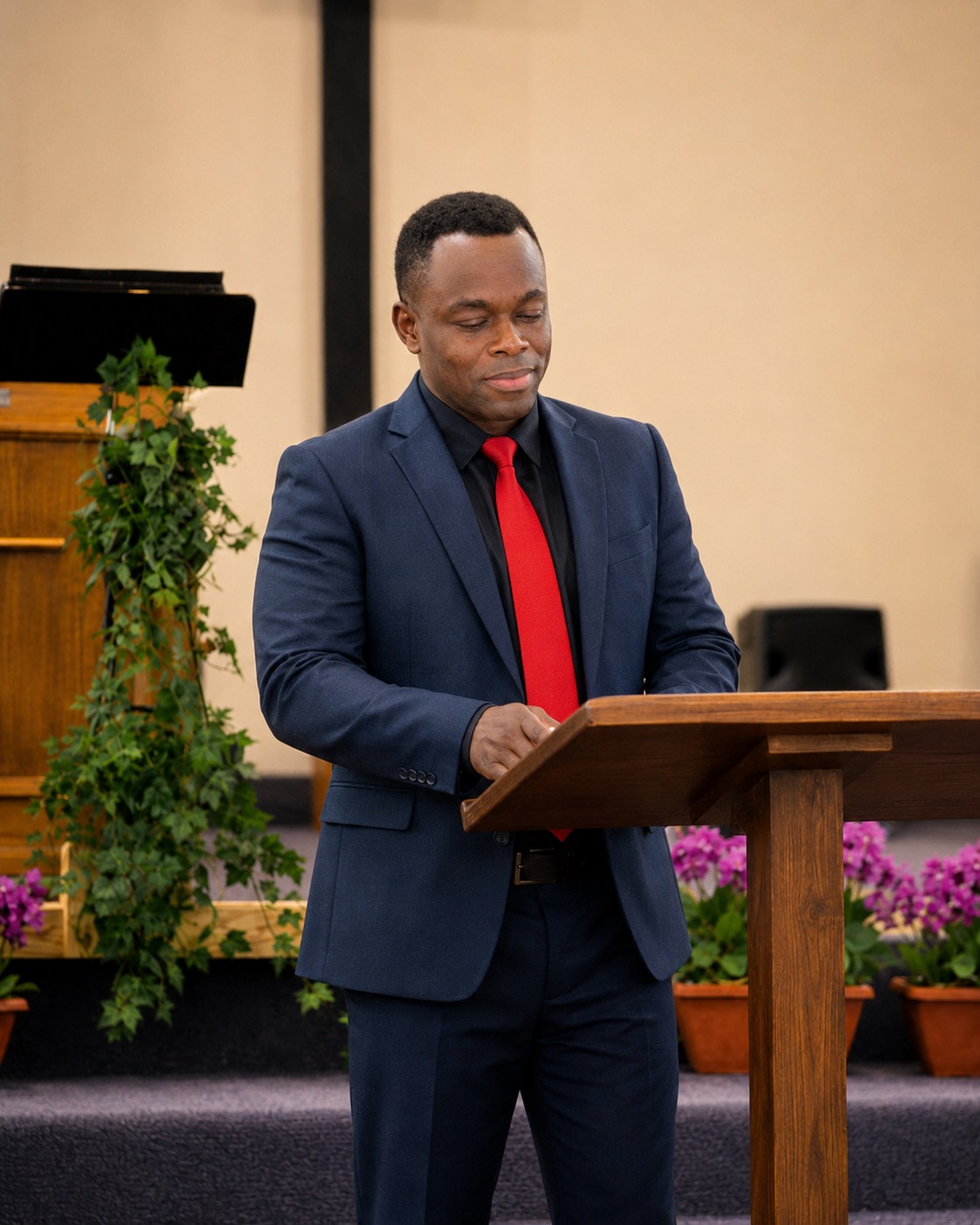 Danny speaking from a church pulpit